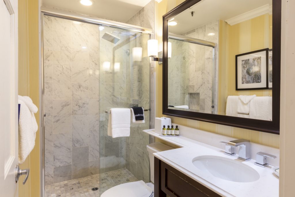 Stand-up shower and single vanity sink in Junior Suite Guest Room